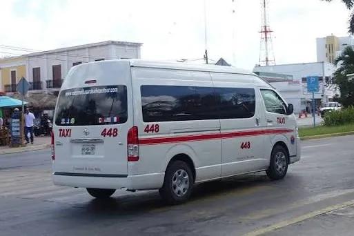 Rear view of Cozumel taxi van number 448 on a downtown street