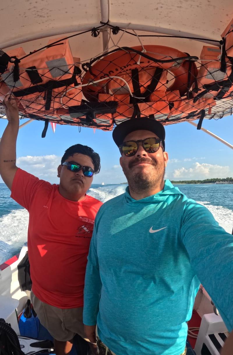Luis Sifuentes Marín aboard a Cozumel dive boat with a fellow diver